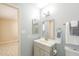 Charming bathroom provides neutral paint and a large mirror at 742 S Rose --, Mesa, AZ 85204