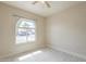 Bright bedroom featuring a ceiling fan and a window with views of the neighborhood at 742 S Rose --, Mesa, AZ 85204