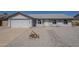 Charming single-story home featuring a two-car garage and a well-manicured, desert-landscaped front yard at 742 S Rose --, Mesa, AZ 85204