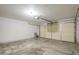 Empty garage interior with shelving and overhead door at 742 S Rose --, Mesa, AZ 85204