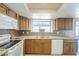 Well-lit kitchen with granite countertops, stainless steel appliances, and stylish backsplash at 742 S Rose --, Mesa, AZ 85204