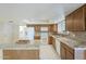Functional kitchen with an island, granite countertops, stainless steel appliances, and ample cabinet space at 742 S Rose --, Mesa, AZ 85204