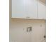 Laundry room with white cabinets, utility sink, and washer/dryer hookups at 742 S Rose --, Mesa, AZ 85204
