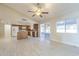 Bright and airy living room offering easy access to the enclosed sunroom and a convenient kitchen layout at 742 S Rose --, Mesa, AZ 85204