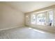 Living Room with natural light through the windows with a view and tile floors at 742 S Rose --, Mesa, AZ 85204