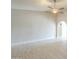 Spacious living room with a ceiling fan, an archway, and light tile floors at 742 S Rose --, Mesa, AZ 85204