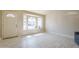 Open living room featuring a bay window with natural light and tile floors at 742 S Rose --, Mesa, AZ 85204