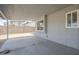 Spacious covered patio with a brick wall and multiple windows, providing a private outdoor space at 742 S Rose --, Mesa, AZ 85204