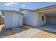 Exterior shot of the shed with a paved walkway leading to the attached carport at 742 S Rose --, Mesa, AZ 85204
