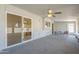 Bright sunroom with sliding glass door, ceiling fan, and a seating area for relaxation at 742 S Rose --, Mesa, AZ 85204