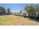 Expansive backyard with lush greenery, mature trees, and views of the greenbelt at 8541 W Sierra Vista Dr, Glendale, AZ 85305