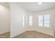 The dinette features wood-look tile flooring and natural light from shuttered windows at 8541 W Sierra Vista Dr, Glendale, AZ 85305