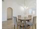 Bright dining area featuring modern lighting, a round table, and neutral decor at 8541 W Sierra Vista Dr, Glendale, AZ 85305