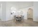 Bright dining area featuring modern lighting, a round table, and neutral decor at 8541 W Sierra Vista Dr, Glendale, AZ 85305