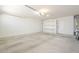 Spacious garage interior with finished concrete floors and built-in shelving at 8541 W Sierra Vista Dr, Glendale, AZ 85305