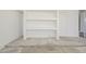Bright garage features built-in shelving for ample storage solutions at 8541 W Sierra Vista Dr, Glendale, AZ 85305