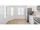 This kitchen features stainless appliances, white cabinetry, and shuttered windows at 8541 W Sierra Vista Dr, Glendale, AZ 85305