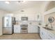 The modern kitchen boasts stainless steel appliances, subway tile backsplash, bright lighting, and a window at 8541 W Sierra Vista Dr, Glendale, AZ 85305