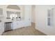 The kitchen features stainless appliances, subway tile backsplash, and archway pass-through to the living room at 8541 W Sierra Vista Dr, Glendale, AZ 85305
