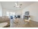Bright and airy living room with a fireplace, modern furniture, and a sliding glass door at 8541 W Sierra Vista Dr, Glendale, AZ 85305