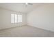 Large main bedroom with carpet flooring, ceiling fan and shuttered windows offering great natural light at 8541 W Sierra Vista Dr, Glendale, AZ 85305