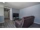 Cozy bonus room with comfortable seating and entertainment setup, perfect for relaxation and leisure at 8964 W Northview Ave, Glendale, AZ 85305