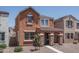Two-story home featuring a covered porch with stone supports and drought-resistant landscaping at 8964 W Northview Ave, Glendale, AZ 85305