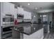 Spacious kitchen with stainless steel appliances, granite countertops, and an open layout to the dining area at 8964 W Northview Ave, Glendale, AZ 85305