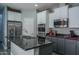 Well-equipped kitchen featuring granite countertops, stainless steel appliances, and ample cabinet space at 8964 W Northview Ave, Glendale, AZ 85305