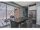 Modern kitchen island with stainless steel appliances, ample counter space, and view of the outdoor patio at 8964 W Northview Ave, Glendale, AZ 85305