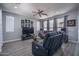 Comfortable living room with a large TV, plush seating, and stylish decor, ideal for relaxing at 8964 W Northview Ave, Glendale, AZ 85305