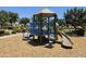 Community playground with a small slide and covered play area on a wood chip surface at 8964 W Northview Ave, Glendale, AZ 85305