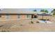 Charming backyard featuring a stone fountain, fire pit, and gazebo with a concrete patio at 909 E Harwell Rd, Phoenix, AZ 85042