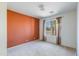 A well-lit bedroom features a window with a view and neutral carpet at 909 E Harwell Rd, Phoenix, AZ 85042