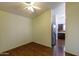Dining area featuring hard wood floors and a stainless steel refrigerator at 909 E Harwell Rd, Phoenix, AZ 85042