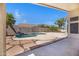 Backyard view showcases the pool, outdoor living space, mountain views, and well-maintained desert landscaping at 10214 E Moonshadow Way, Gold Canyon, AZ 85118