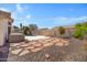 Backyard features a pool, spa, stone pavers, and desert landscaping at 10214 E Moonshadow Way, Gold Canyon, AZ 85118