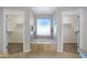 Bathroom features a standalone tub, and two walk-in closets at 10214 E Moonshadow Way, Gold Canyon, AZ 85118