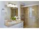 Bathroom features a tiled shower and a vanity at 10214 E Moonshadow Way, Gold Canyon, AZ 85118