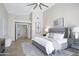 Well-lit bedroom features neutral tones and vaulted ceilings at 10214 E Moonshadow Way, Gold Canyon, AZ 85118