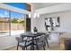 Modern dining area with a mountain view through a large window at 10214 E Moonshadow Way, Gold Canyon, AZ 85118