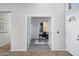 Open entryway leading to a study, featuring neutral tones and clean lines at 10214 E Moonshadow Way, Gold Canyon, AZ 85118