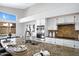 Open kitchen design with a large granite island and stainless steel appliances at 10214 E Moonshadow Way, Gold Canyon, AZ 85118