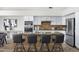 Kitchen island with granite countertop and bar seating at 10214 E Moonshadow Way, Gold Canyon, AZ 85118