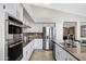 Spacious kitchen featuring granite countertops, stainless steel appliances, and modern fixtures at 10214 E Moonshadow Way, Gold Canyon, AZ 85118