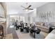 Spacious living room featuring a cozy fireplace and comfortable seating, perfect for relaxation and gatherings at 10214 E Moonshadow Way, Gold Canyon, AZ 85118