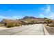 Quiet street with beautiful homes, mountain views, and desert landscaping at 10214 E Moonshadow Way, Gold Canyon, AZ 85118
