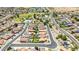 An aerial view of a Gathering-friendly community complete with a playground, school, and swimming pool at 10521 W Donald Dr, Peoria, AZ 85383