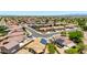 A neighborhood showing the house and others with manicured lawns and desert landscaping, and residential solar at 10521 W Donald Dr, Peoria, AZ 85383