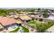 Aerial view of a home with a covered patio and spacious backyard, surrounded by lush landscaping at 10521 W Donald Dr, Peoria, AZ 85383